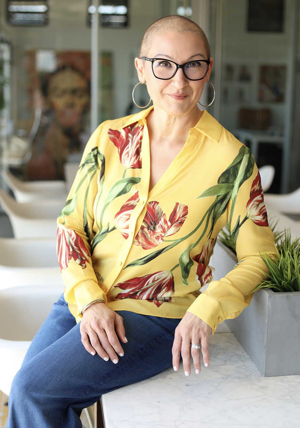 Dr. Jill White seated in a yellow blouse